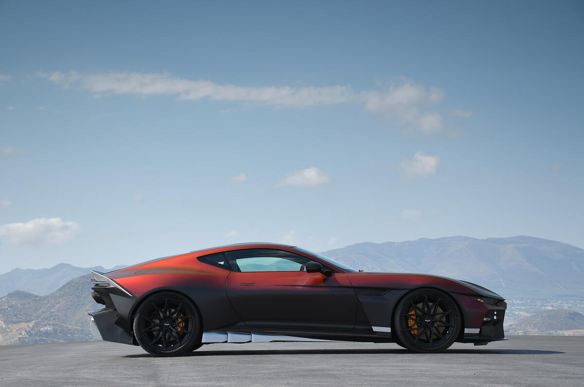 Aston Martin Valen rear three-quarter view showing the abrupt cut-off tail, exposed carbon structure and full-width light bar